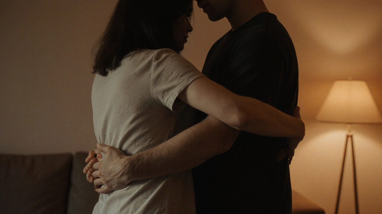 Two people standing back-to-back, hands slowly gliding up arms in a tender, wordless connection.